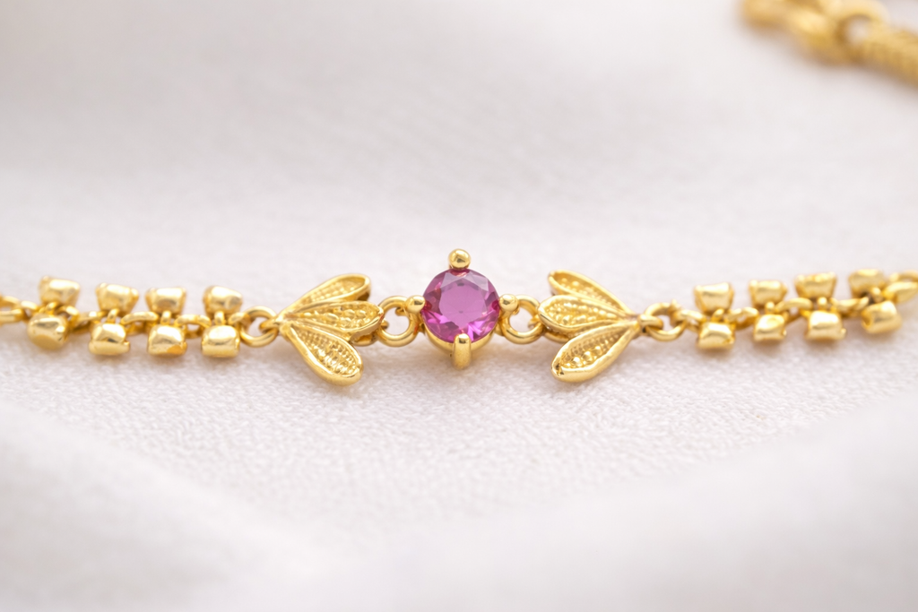 Elegant Gold Floral Bracelet with Pink Stone & Leaf Motif