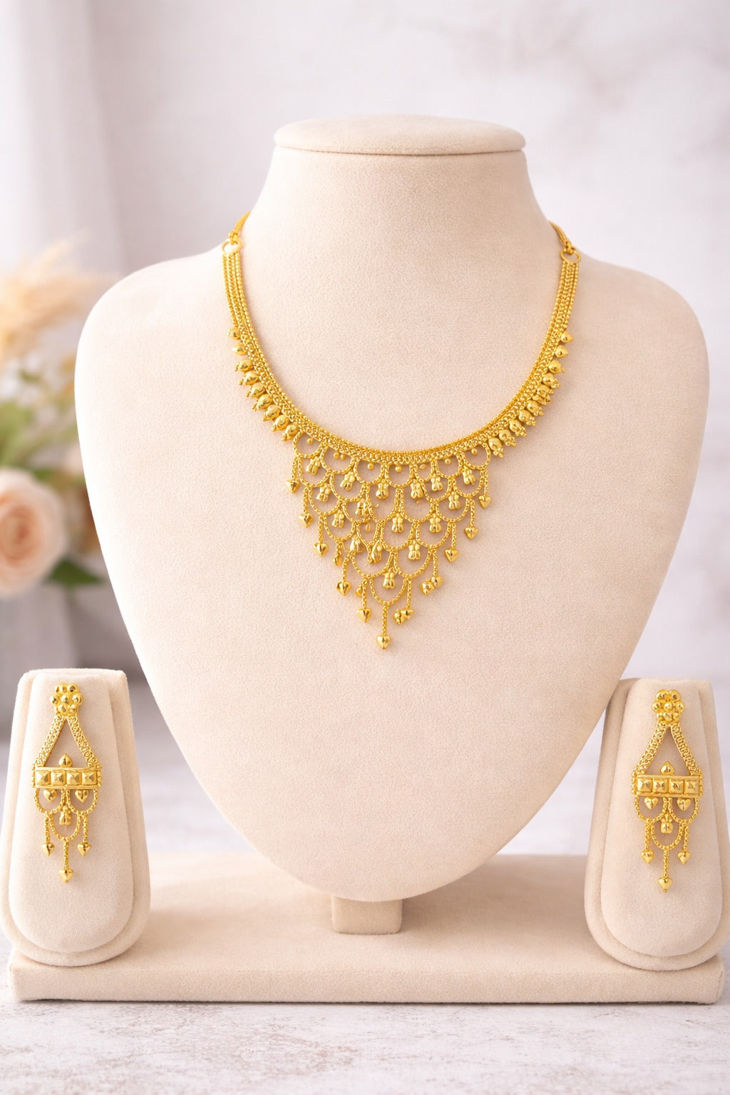Regal Cascade Gold Necklace Set with Layered Dangling Charms & Matching Earrings