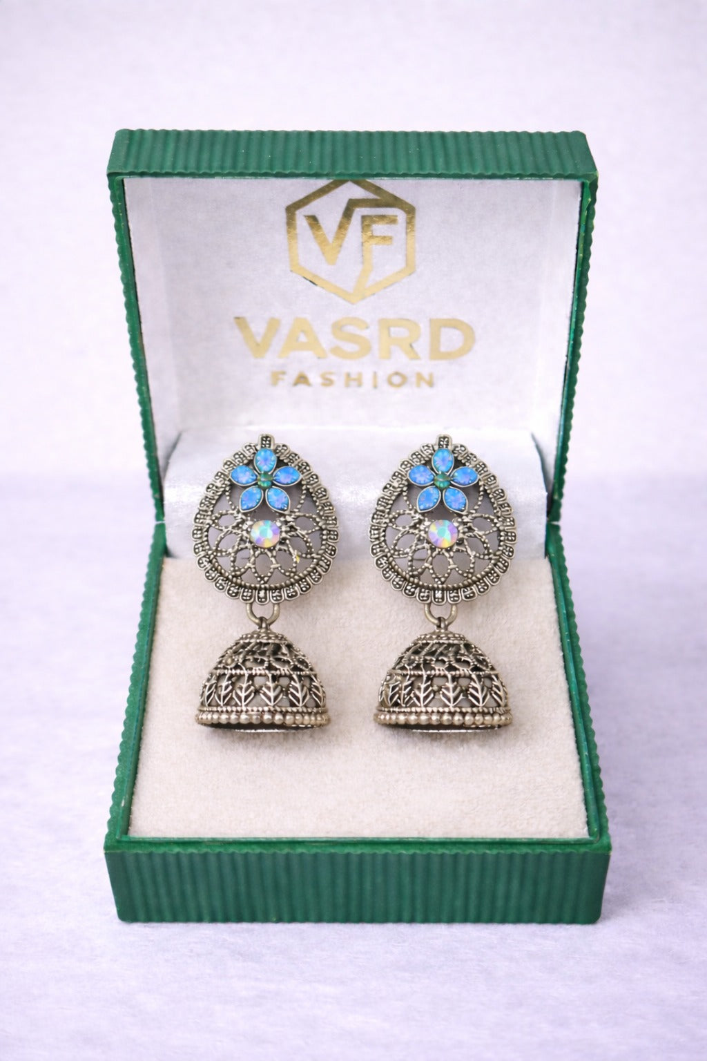 Oxidized Silver Floral Jhumka Earrings with Blue Stone & Crystal Accent